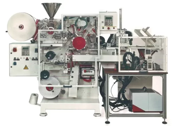 This machine produces a double-chamber bag with string and tag. This machine is available as manual packing machine, also with single row cartoning device up to 25 tea bags with multi-row cartoning device for boxes up to 100 tea bags.